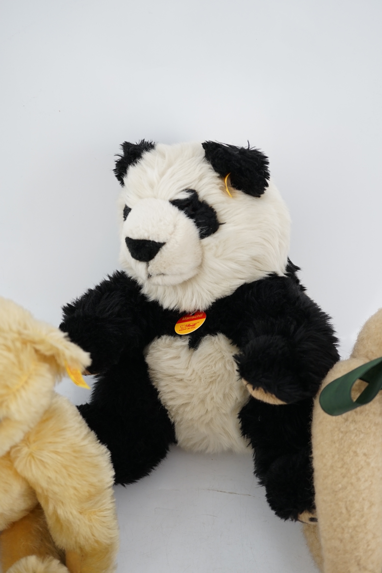 A Steiff Panda yellow tag, a Steiff bear yellow tag, an artist bear and a Steiff orange tag bear (4)